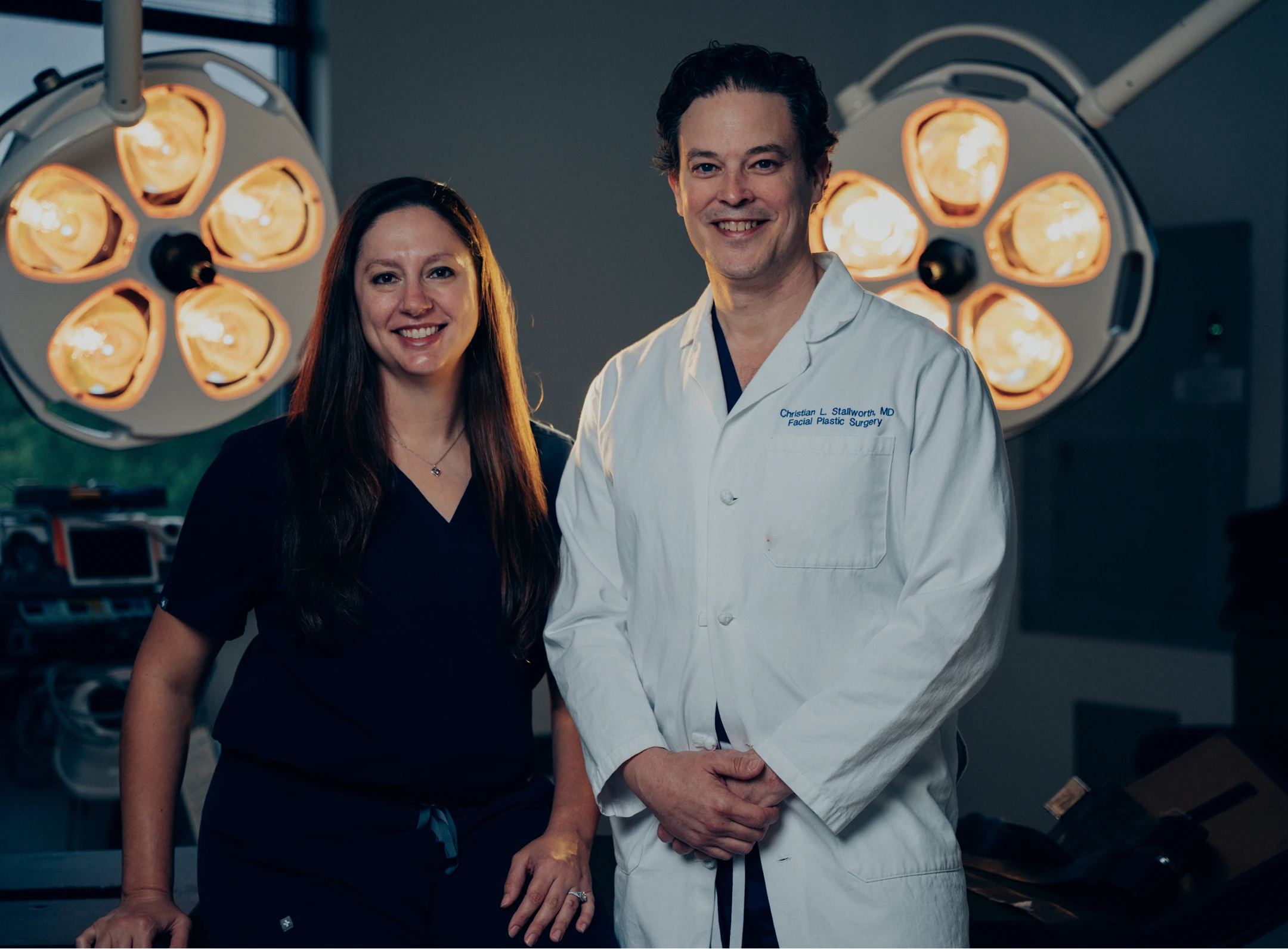 Dr Stallworth MD standing in operating room with surgical lights overhead - in San Antonio, TX