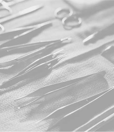 Surgical instruments and medical tools laid out on sterile gauze in preparation for a medical procedure