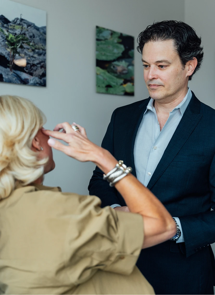 Dr Stallworth MD consultating blonde female client during session in professional medical office setting - Doctor in San Antonio, TX